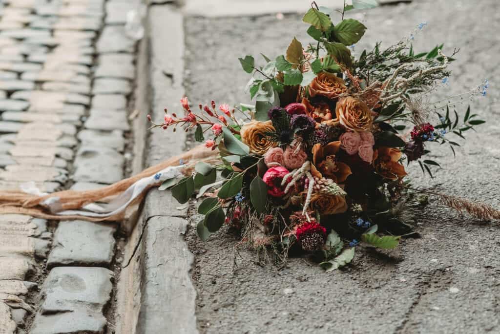 autumn wedding bouquet on the pavement
