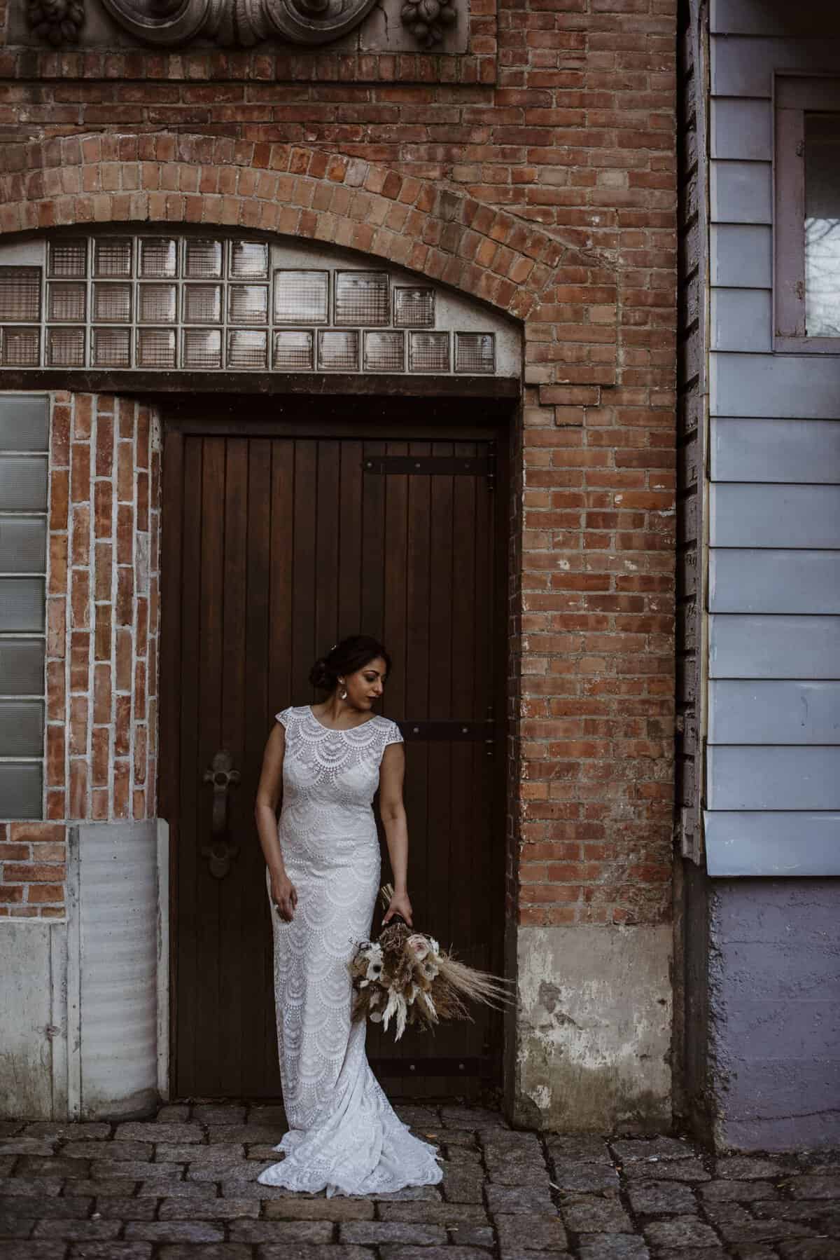 boho bride in a doorway