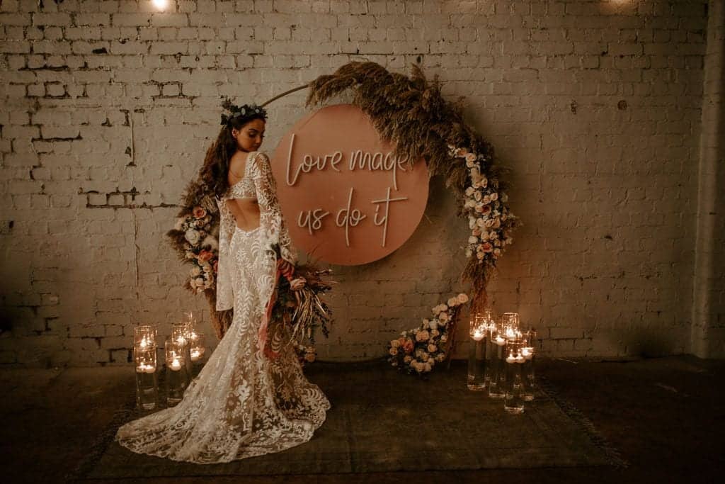 bride and a sign