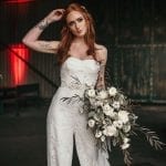 bridal jumpsuit with bouquet