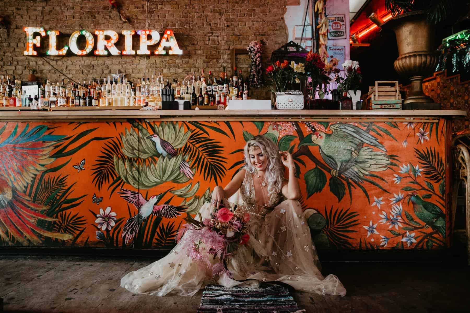 bride on floor in wedding dress