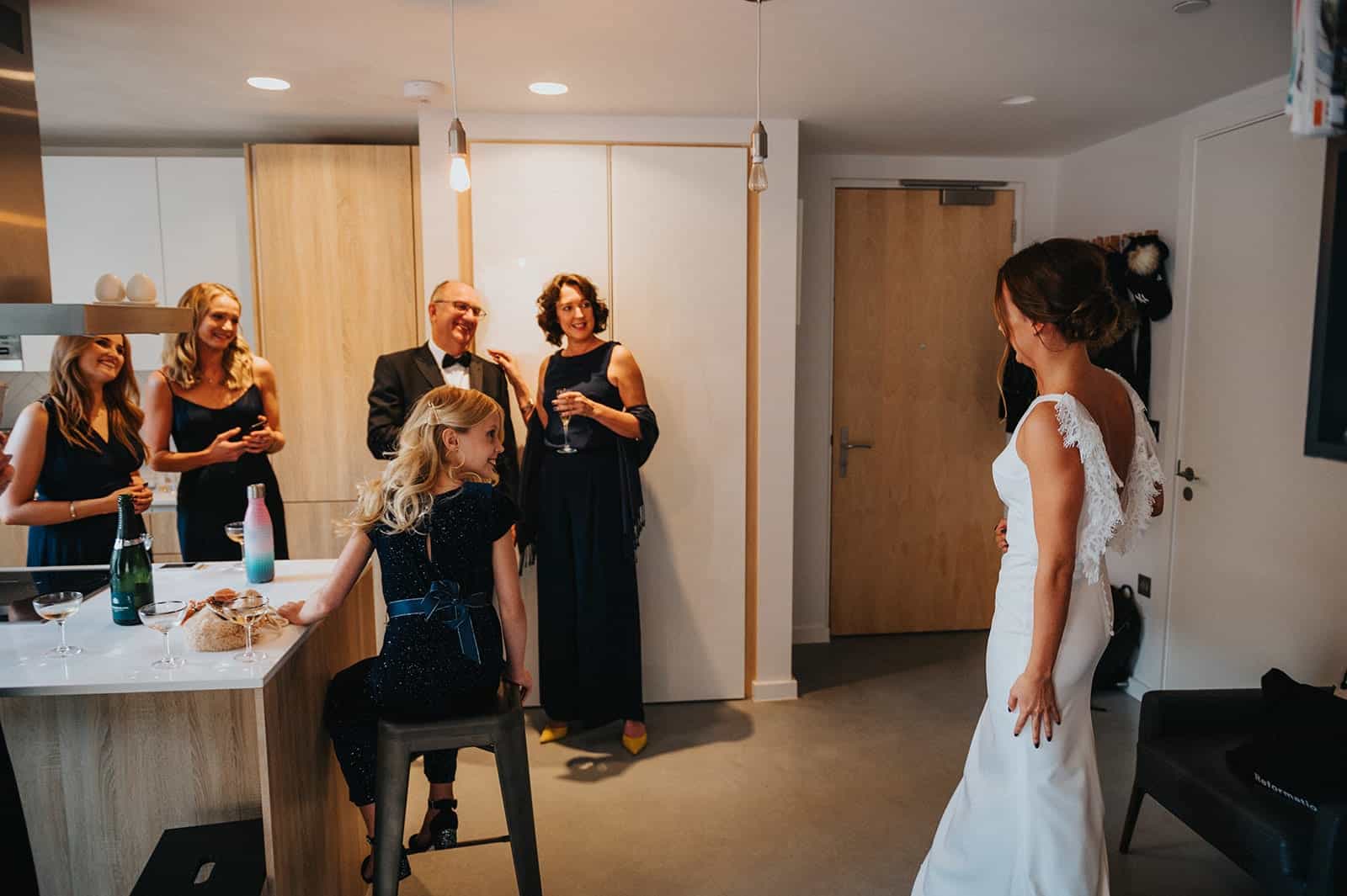 bride doing first look with mother of the bride and bridesmaids