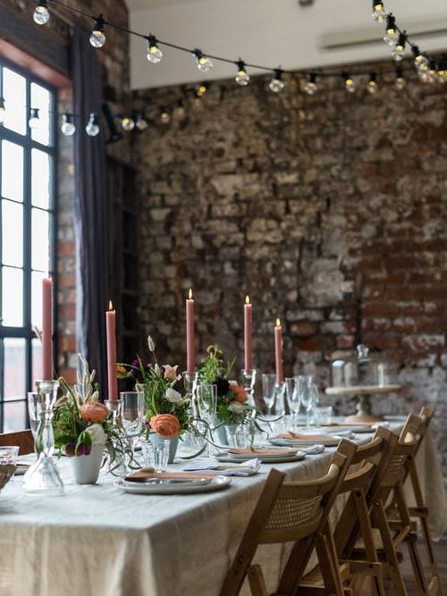 a wedding table set up inside the forge 