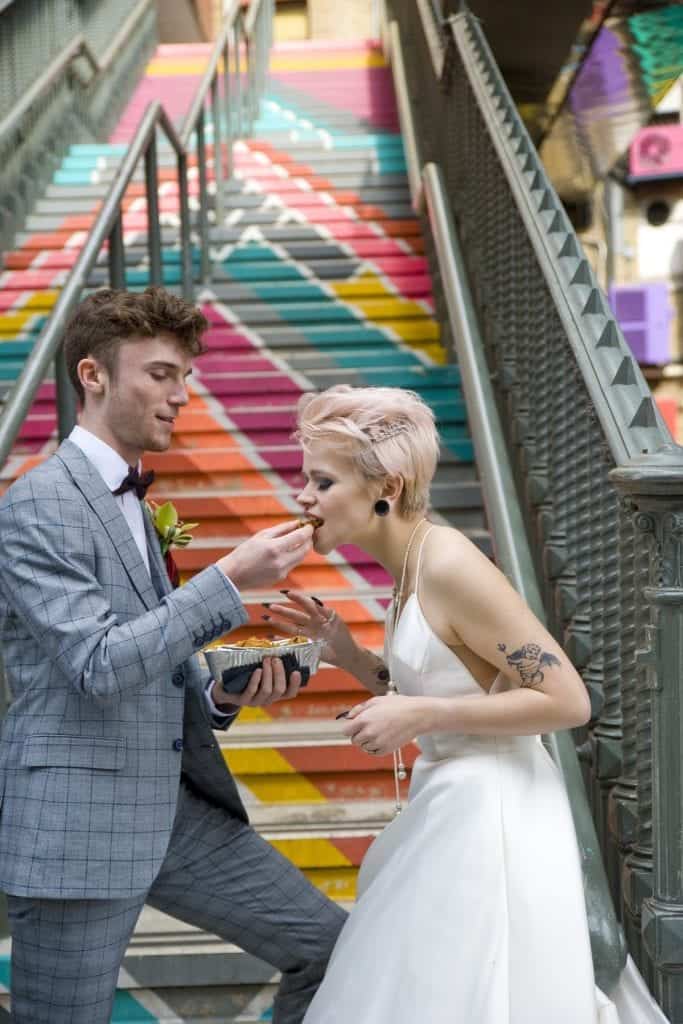 wedding couple eating street food