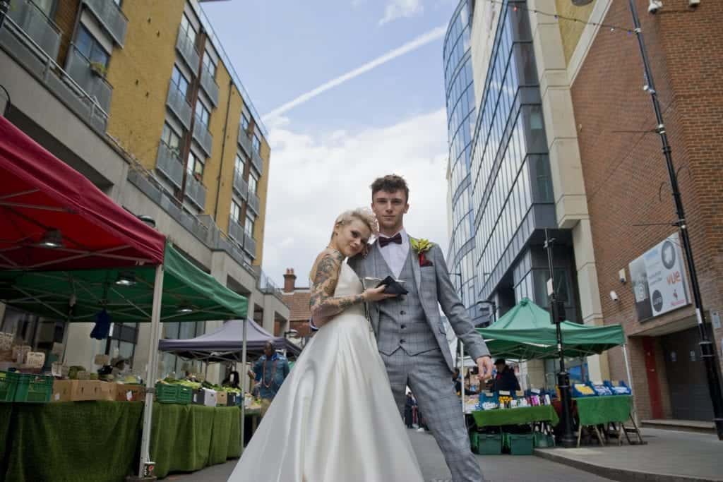 wedding couple on a market street