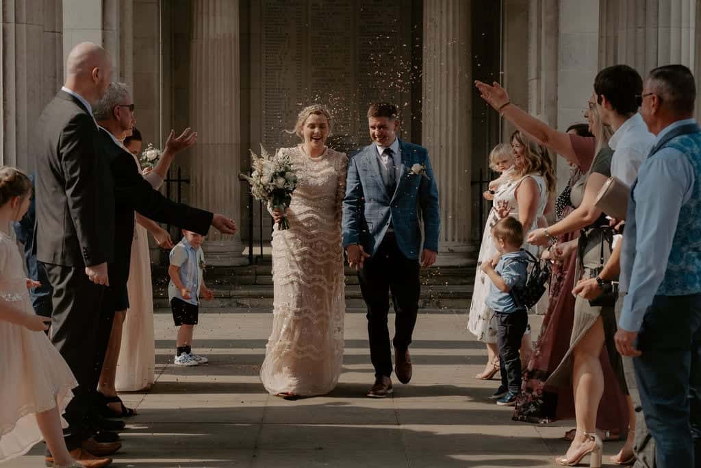 walking the streets as a married couple bride with high neckline dress