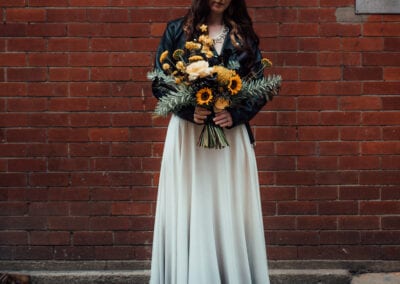 bride in ombre dress with bridal jacket