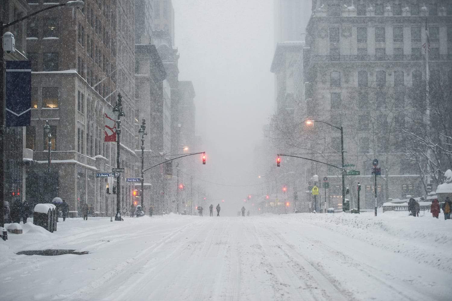 a city scape with snow falling 