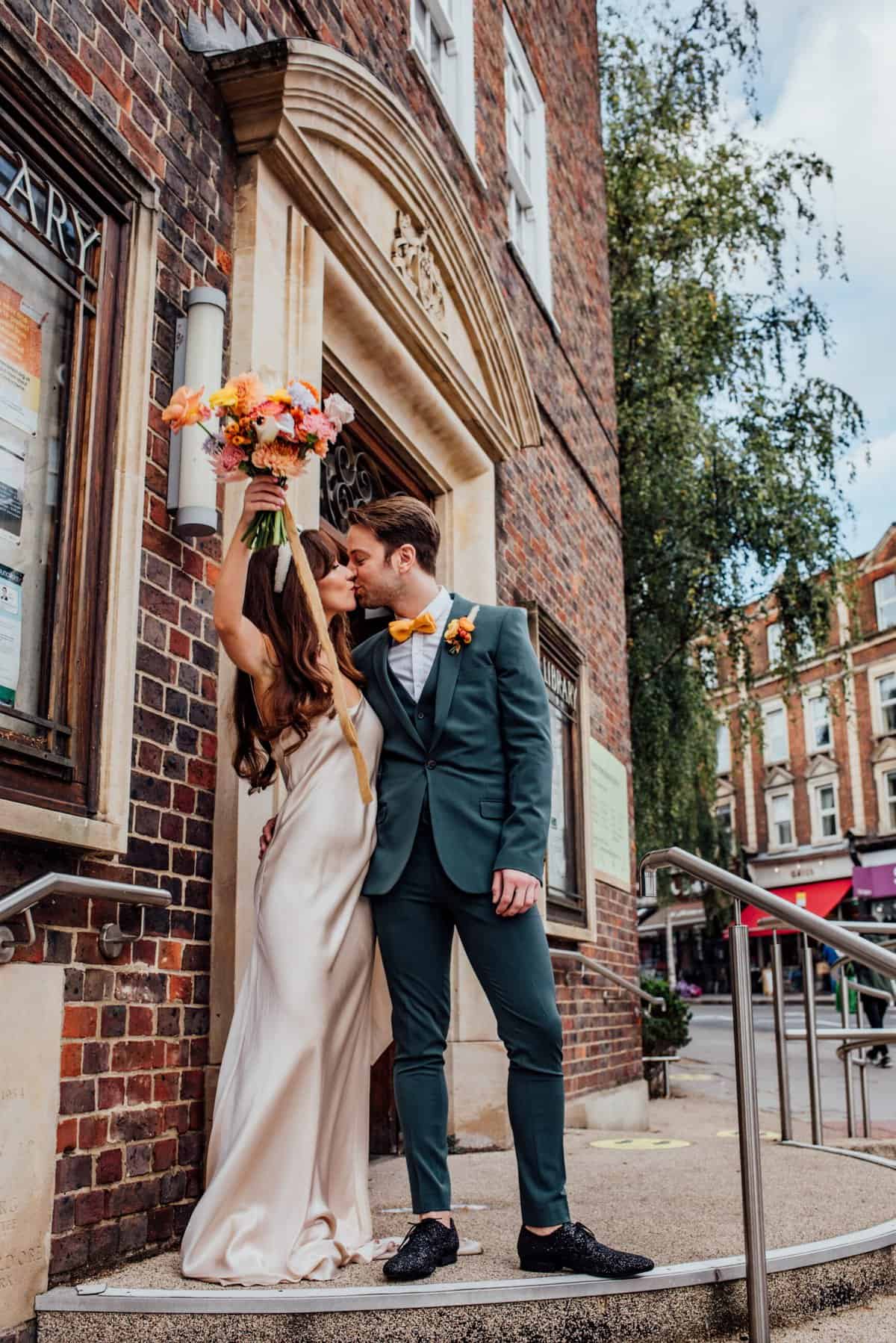 urban disco wedding, couple kissing outside