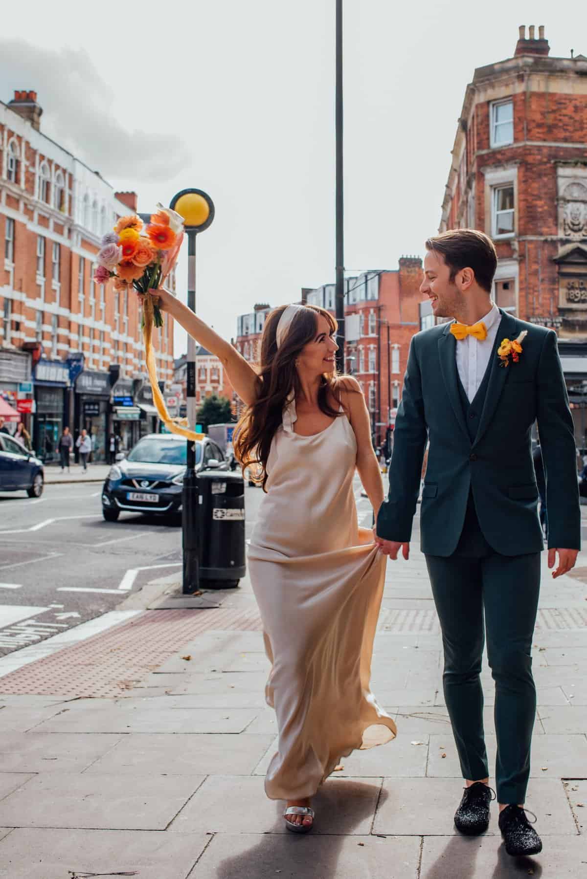 urban disco wedding, couple crossing the street