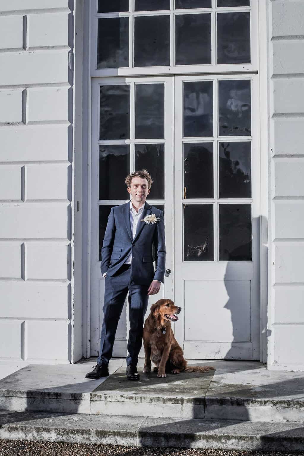 groom and dog