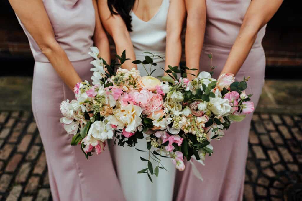 bridesmaid showing their wedding flowers