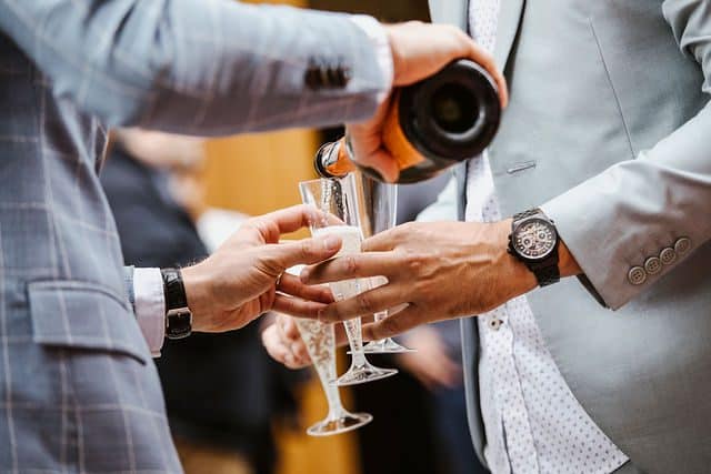 drinking champagne at switzerland wedding