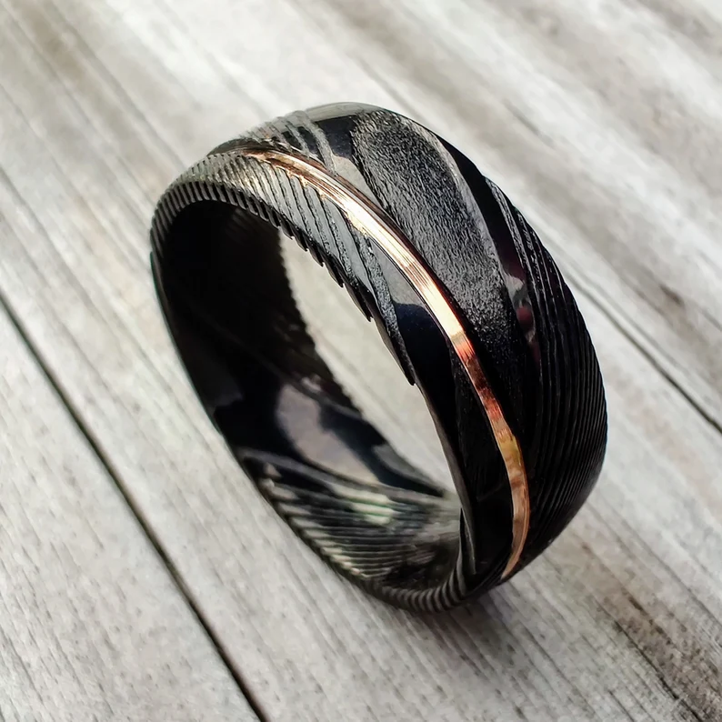 rose gold and black stainless steel ring
