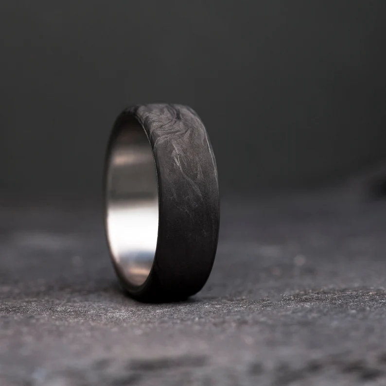 black titanium wedding ring with swirl detail