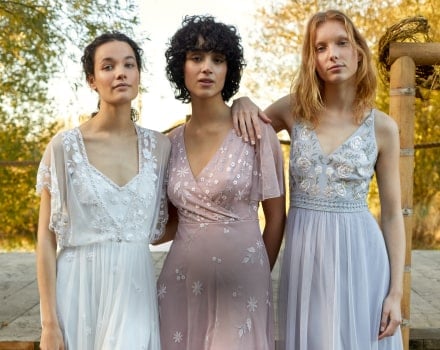bride with two bridesmaids all wearing monsoon dresses