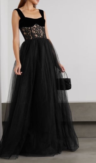 a black wedding dress with see through lace belly detail, full tulle gown style skirt