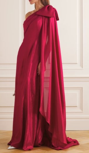 red dress with big bow on shoulder with draping fabric