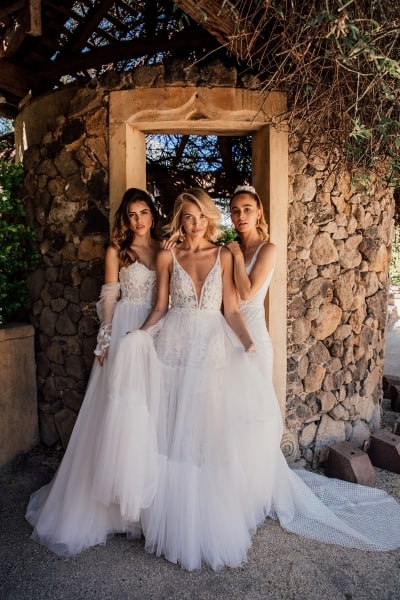 bride and 2 bridesmaids all wearing bridesmaid dresses