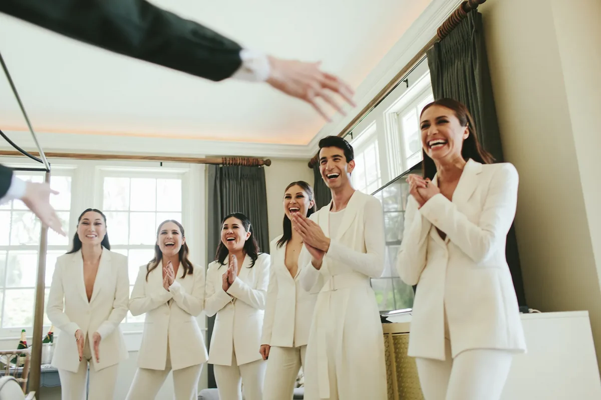 bridesmaid in white pantsuits