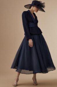 mother of the bride in a navy skirt and jacket two piece