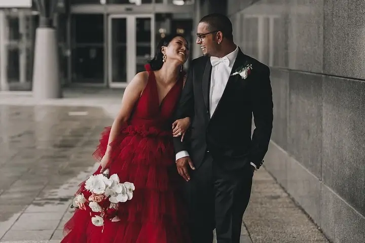 bride and groom in red and black 