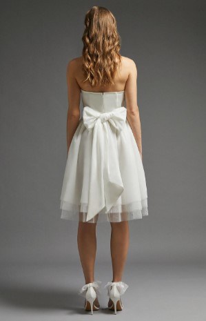 back of knee length wedding dress with big bow