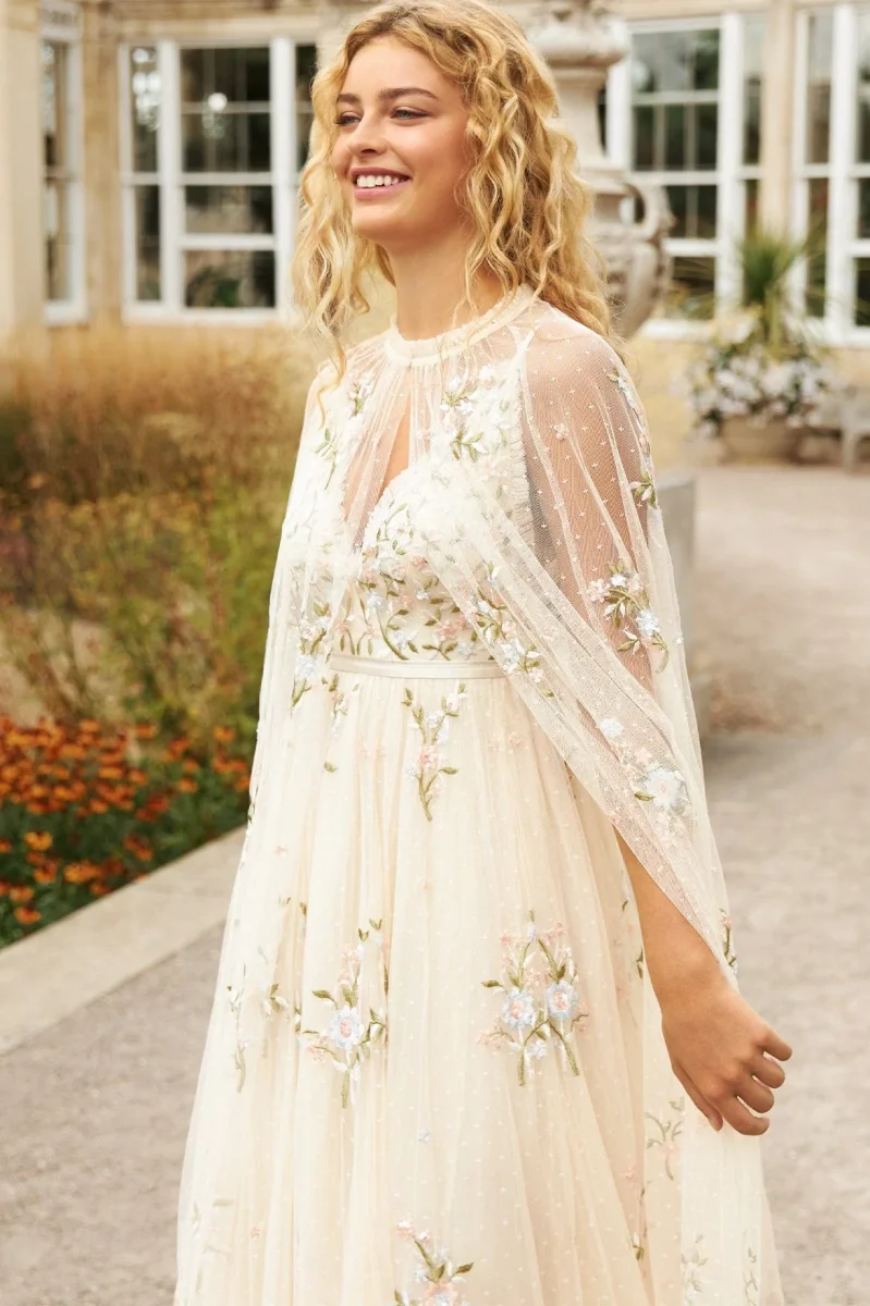 wedding dress and cape with floral detail all over