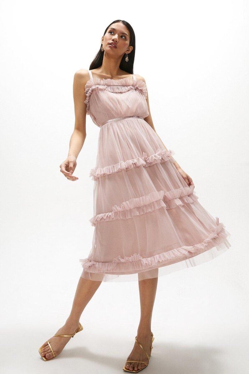 blush midi dress with thin straps and ruffle detail on neckline 