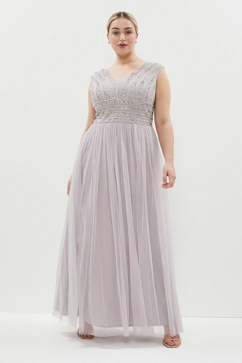 plus size model in a lilac bridesmaid dress