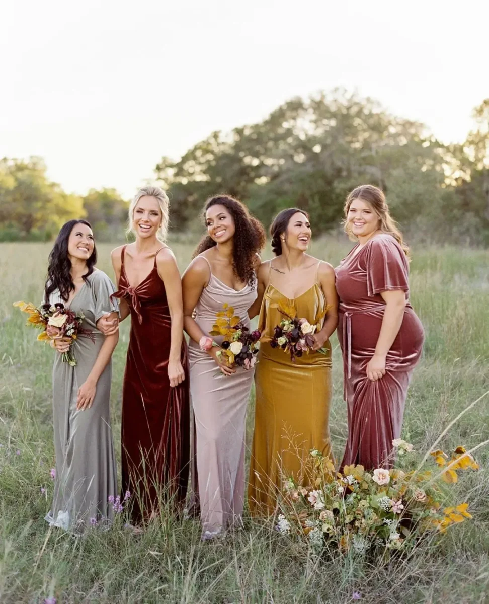 mustard, pink and berry coloured velvet bridesmaid dresses
