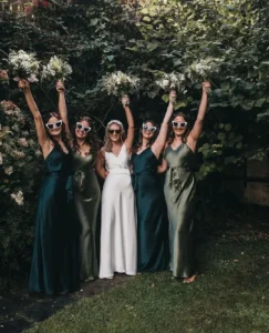 bride and bridesmaid in olive green bridesmaid dresses