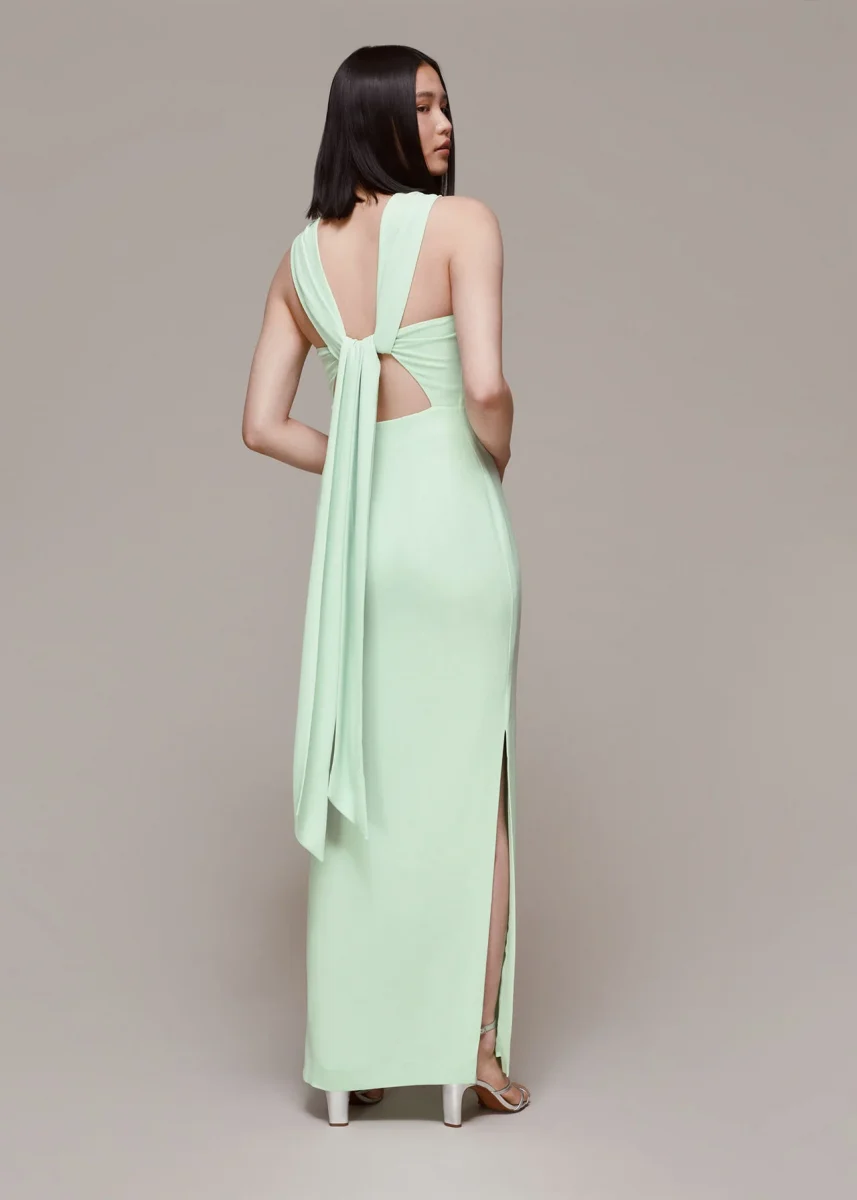 bridesmaid showing off the back of her mint green dress