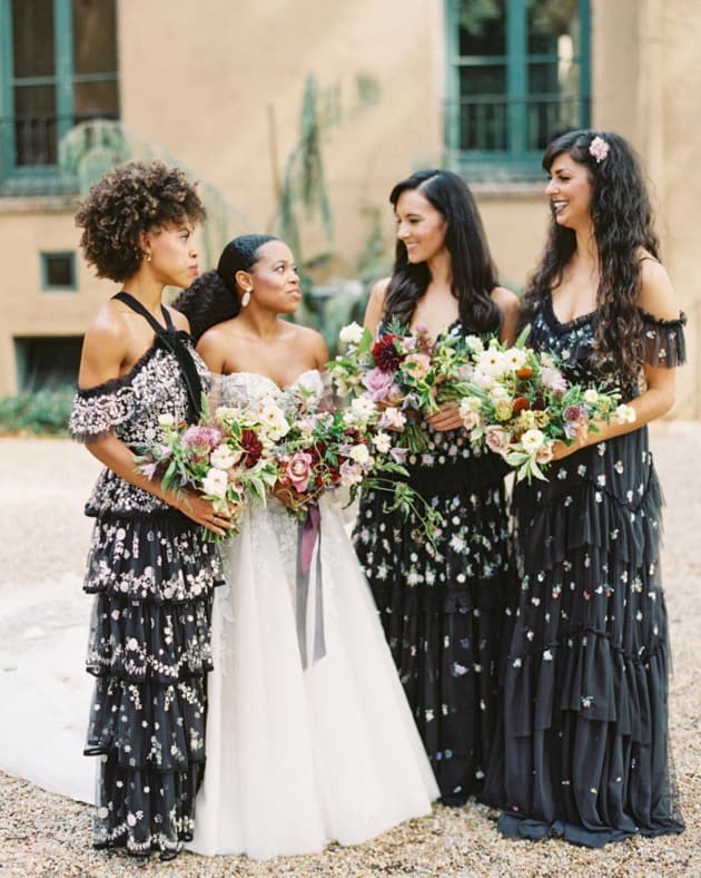 bride with bridesmaid in black bridesmaid dresses