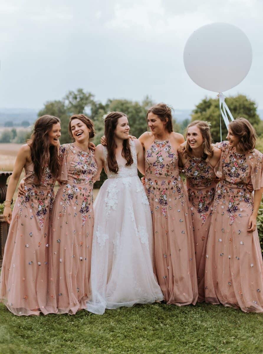 bride with bridesmaid in embroidered dresses