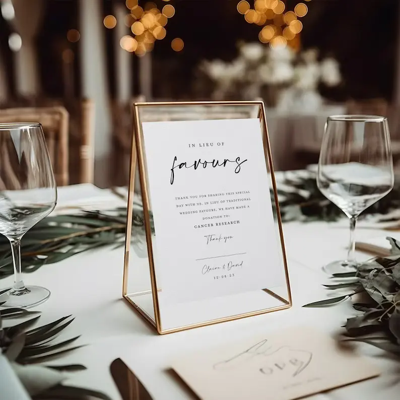 table sign explaining charity wedding favour