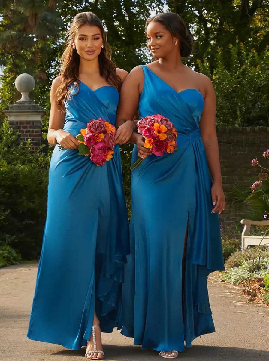 two bridesmaid in blue one shoulder dresses