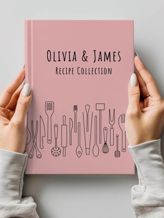 hands holding a personalised recipe book