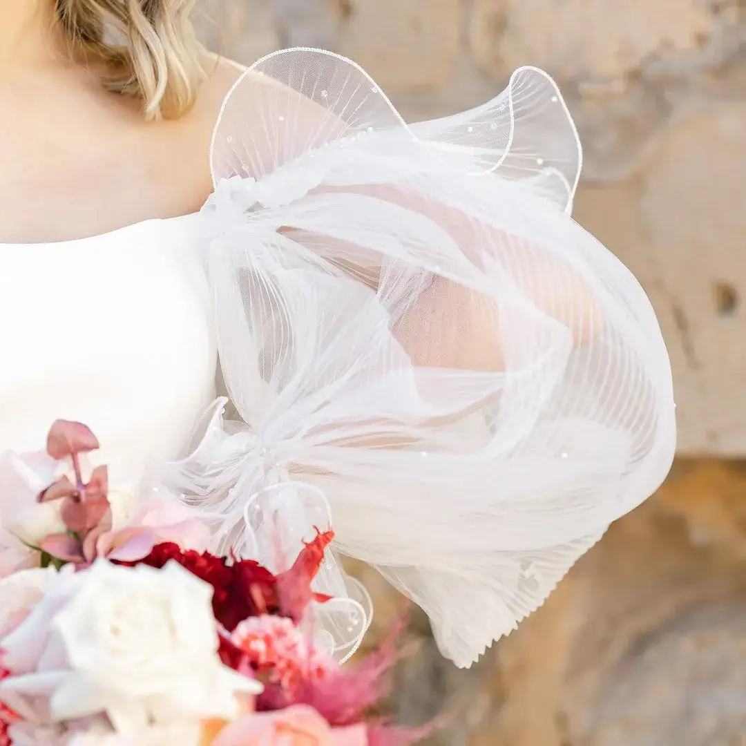 close up of puff sleeves on bride