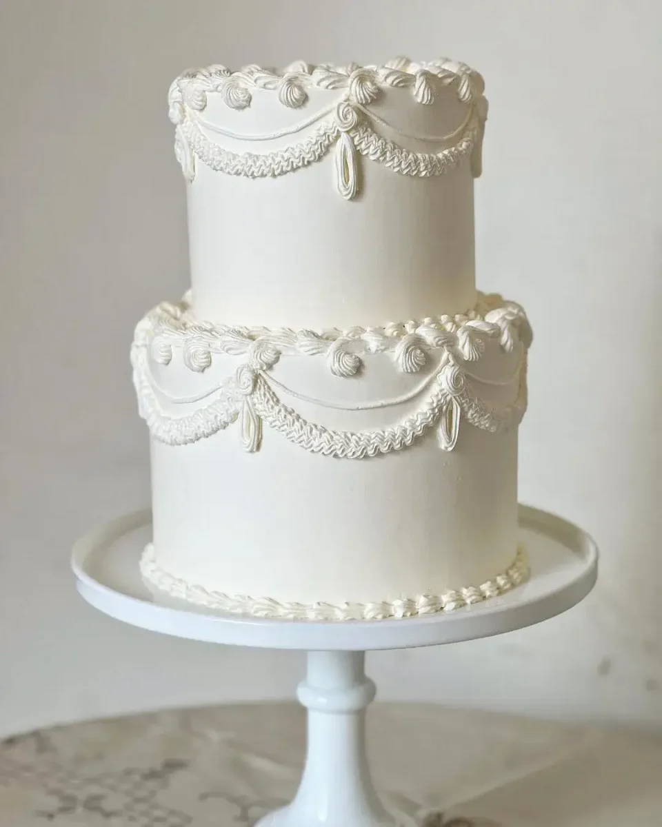 two tier simple vintage iped buttercream cake