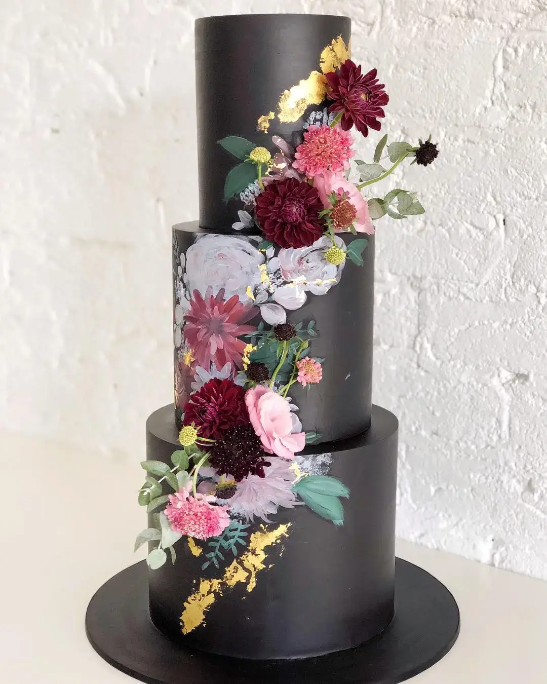 black cake with handpainted and real floral design
