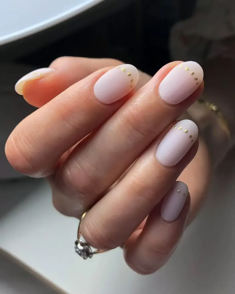 dot line on top of nails in neutral colour