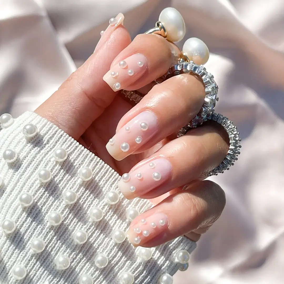 long nails with pearls on them 