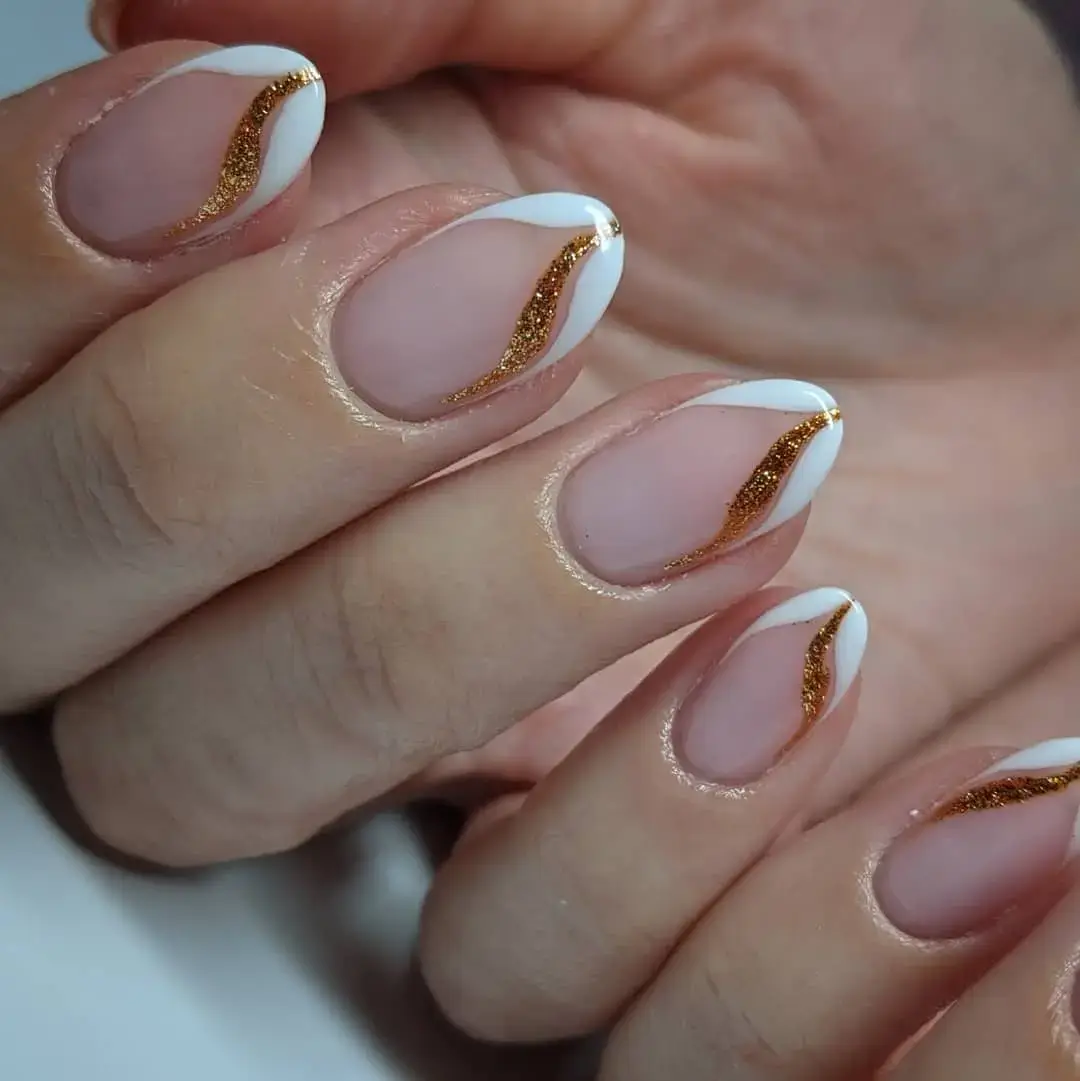 gold and white swirl tip bridesmaid nails