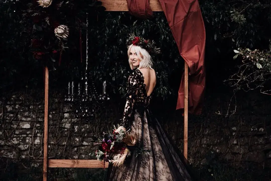 bride in black dress and flower crown