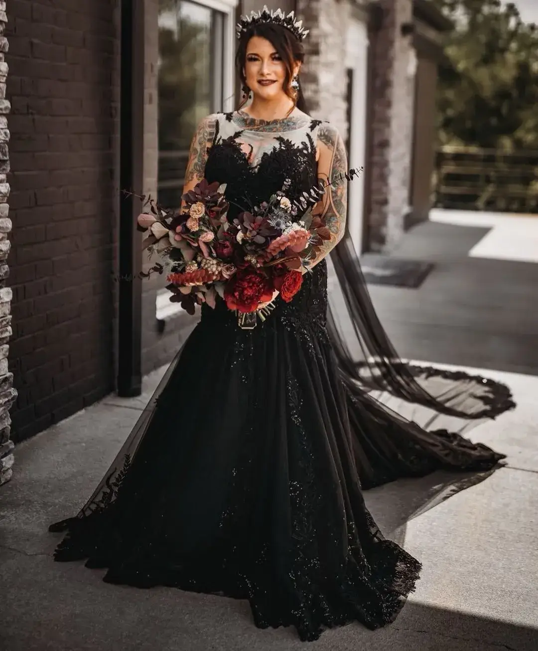 bride holding bold bouquet and wearing a gothic flower crown 
