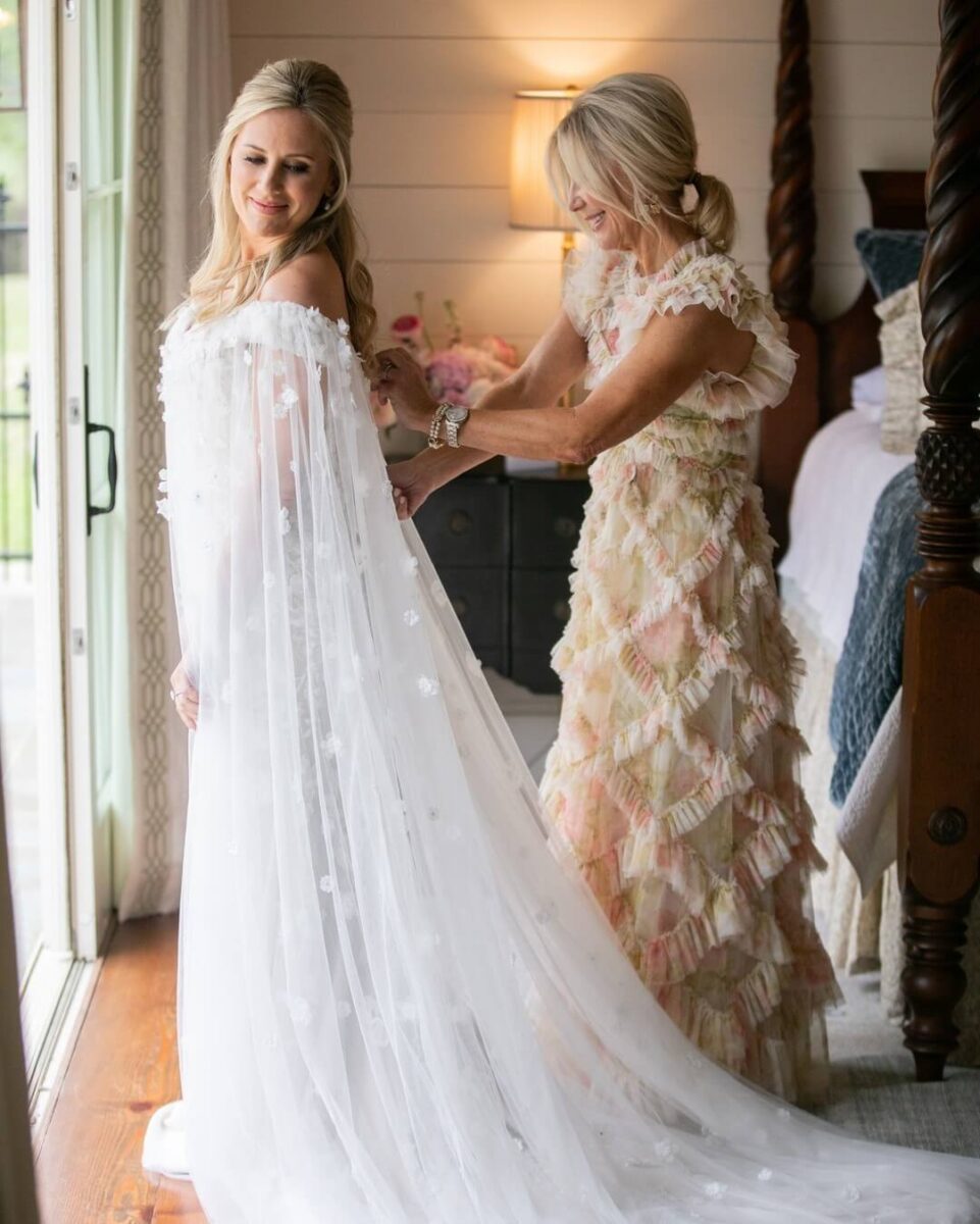 bride with her mother getting ready, mother in ruffled yellow dress