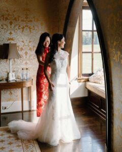 bride with mother, mother in red a line dress