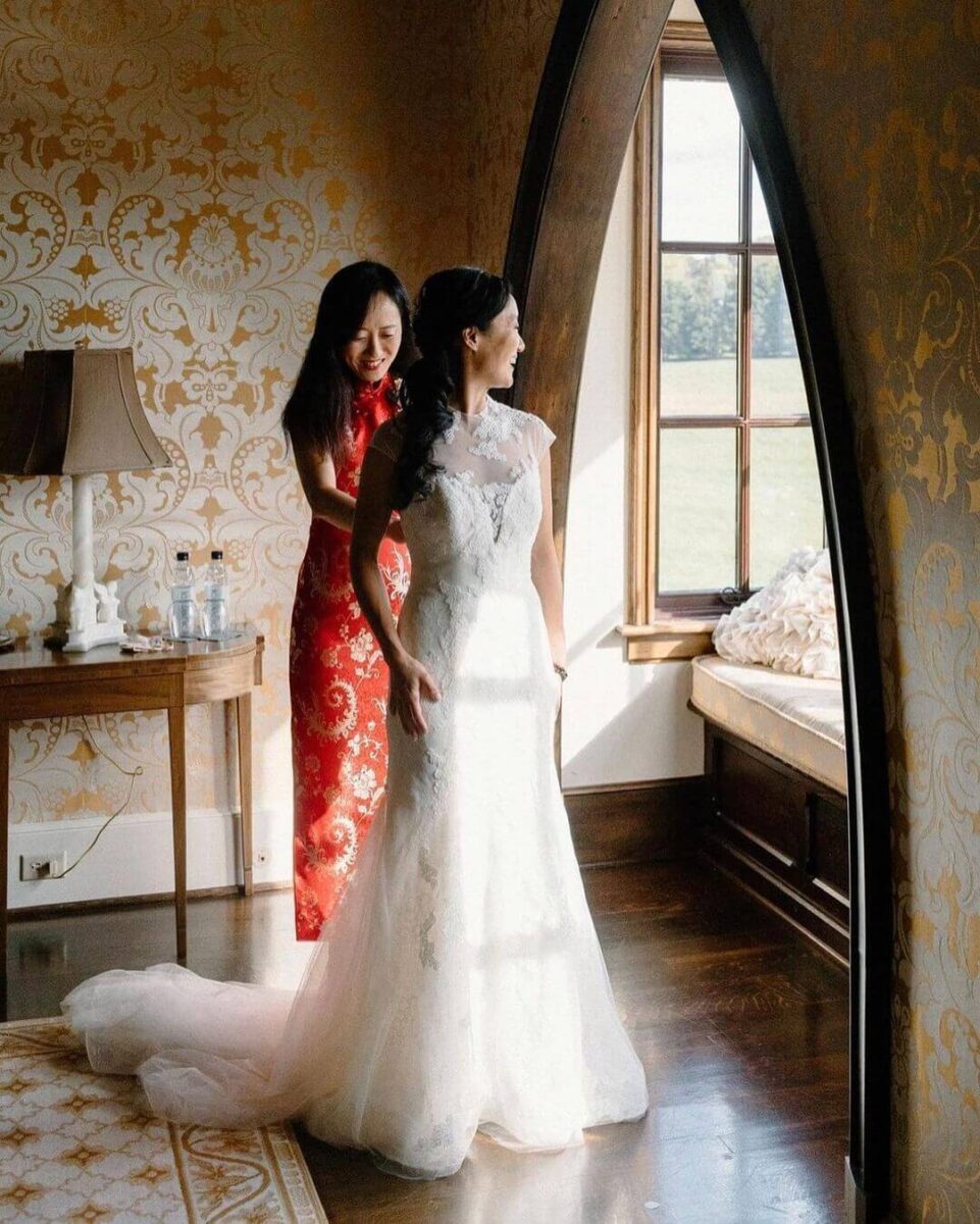 bride with mother, mother in red a line dress