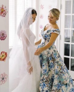 bride with her mother in a unique blue and white patterned dress